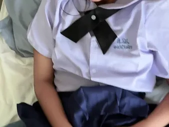 Watch Suwipha, a sexy Thai schoolgirl in college uniform, take a indestructible pounding from a imperceptive milky rod